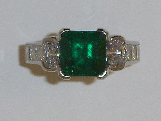 Emerald cut Emerald and diamond ring