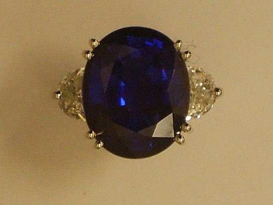 Oval Sapphire with Trillion Diamonds next to it