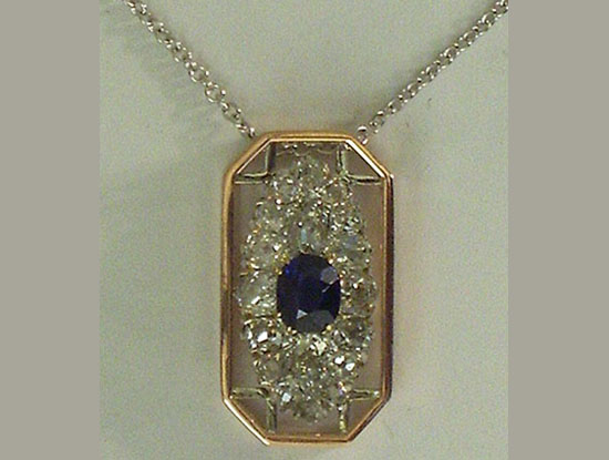 Rose Gold, Platinum & Diamonds With a Sapphire in the Center
